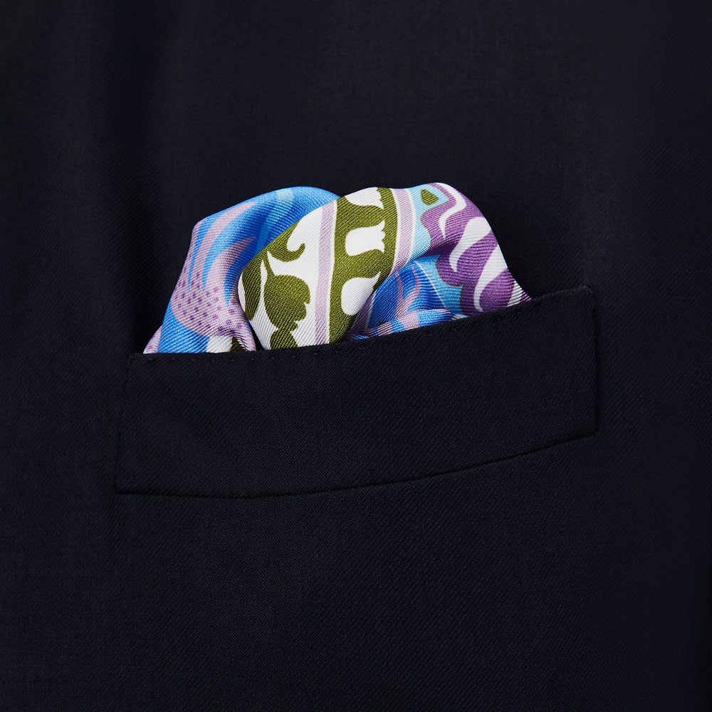 The Turnbull & Asser Green Multi Griffins Silk Pocket Square features blue mythical griffins at the center and decorative pink, gold, and blue borders—an ideal accessory for autumn ensembles.