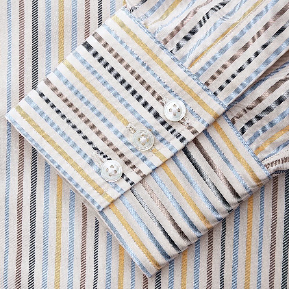 The Turnbull & Asser Yellow Multi Stripe Regular Fit Shirt features a T&A collar, 3 button cuffs, and thin blue, yellow, and light brown stripes on white for a classic formal look.