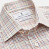 View 2 of product The Turnbull & Asser Red Multi Check Regular Fit Cotton-Cashmere Shirt features a T&A collar, 3 button cuffs, and a multicolored check pattern on white, shown laid flat against a white surface.