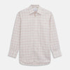 View 1 of product The Turnbull & Asser Red Multi Check Regular Fit Cotton-Cashmere Shirt features a T&A collar, 3 button cuffs, and a multicolored check pattern on white, shown laid flat against a white surface.