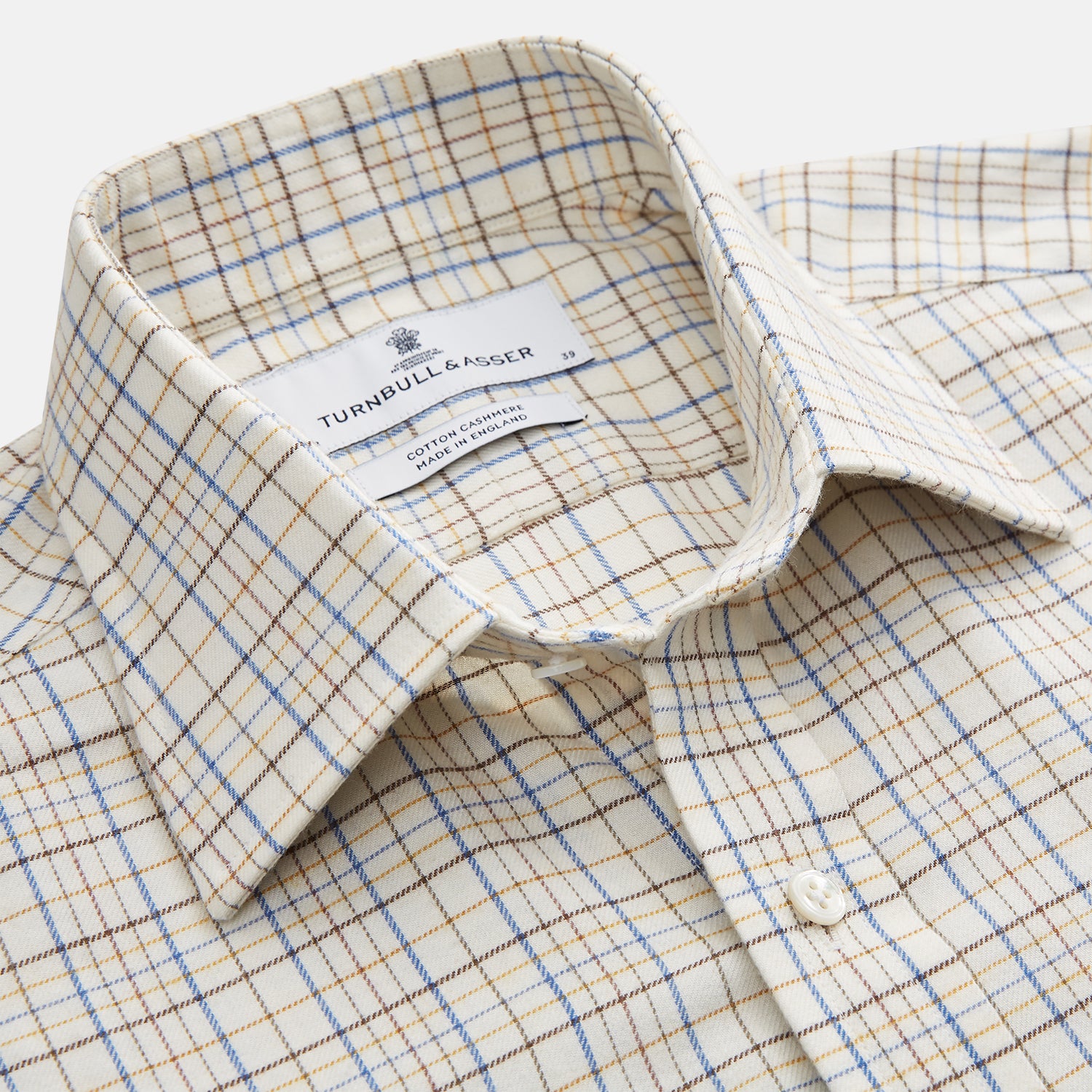 View 2 of product The Turnbull & Asser Brown Multi Check Regular Fit Cotton-Cashmere Shirt features a white base with blue, yellow, and brown checks, T&A collar, and 3 button cuffs for a smart-casual look.