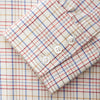 View 3 of product The Turnbull & Asser Red Multi Check Regular Fit Cotton-Cashmere Shirt features a T&A collar, 3 button cuffs, and a multicolored check pattern on white, shown laid flat against a white surface.