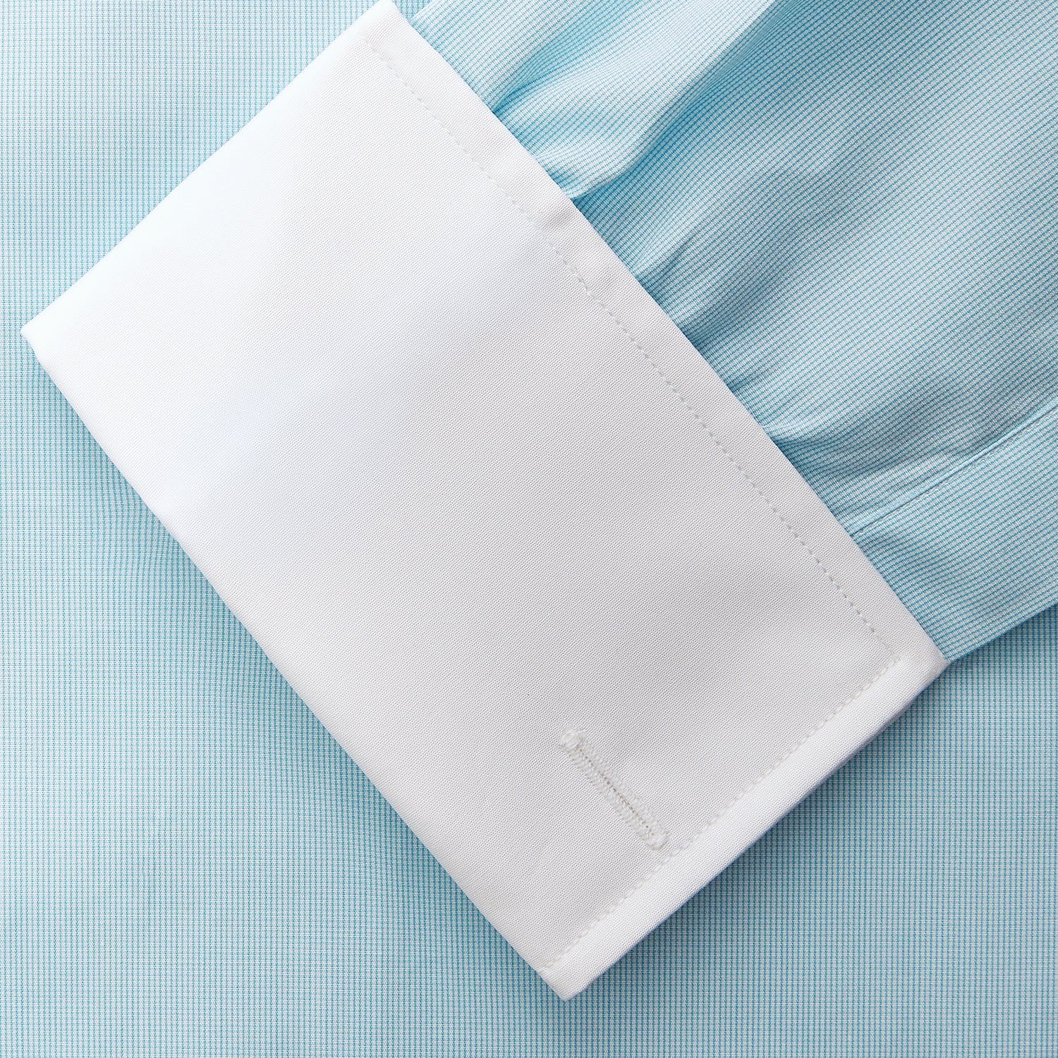 View 3 of product Green micro-check regular fit shirt by Turnbull & Asser, featuring a white T&A collar, double cuffs, and button-down front, laid flat on a white background.