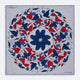 The Blue and Red Foliage Pattern Silk Pocket Square by Turnbull & Asser features intricate symmetrical leaves and flowers in red, blue, and navy on a light grey silk background, creating an elegant circular motif.