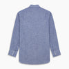 View 5 of product The Turnbull & Asser Blue Chambray Cotton Regular Fit Mayfair Shirt features a subtle textured pattern, pointed T&A collar, and white buttons. Shown here in a light blue shade, laid flat on a white background.