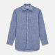 The Turnbull & Asser Blue Chambray Cotton Regular Fit Mayfair Shirt features a subtle textured pattern, pointed T&A collar, and white buttons. Shown here in a light blue shade, laid flat on a white background.