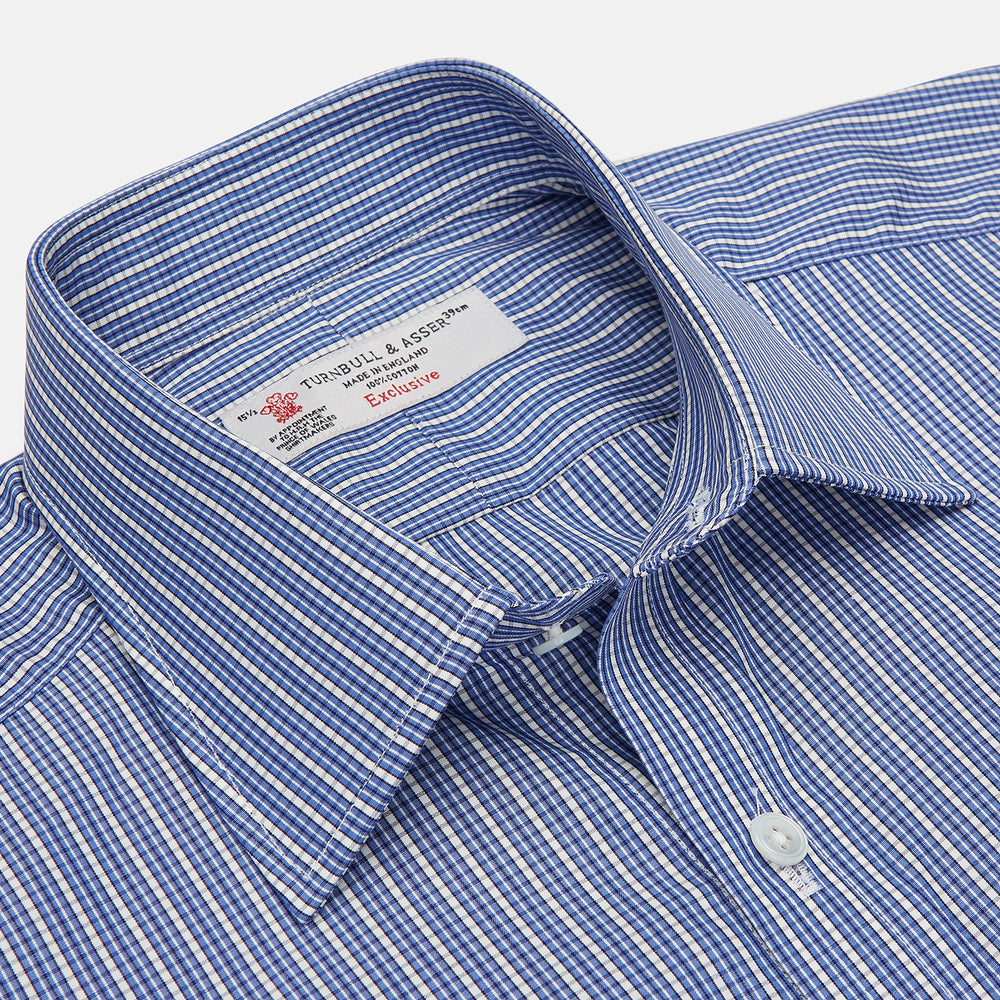 The Turnbull & Asser Navy Rich Check Shirt features a T&A collar, 3-button cuffs, and a checked pattern, shown laid flat on a white background.