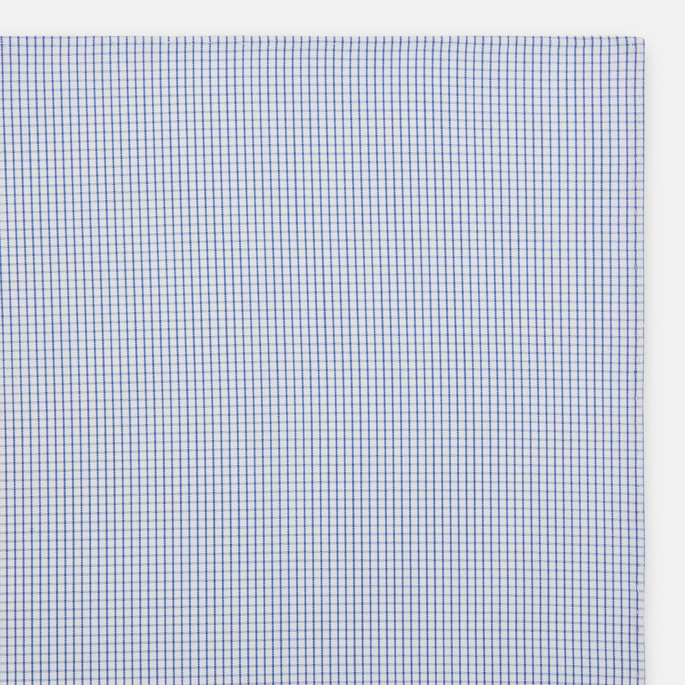 The Turnbull & Asser Hand Rolled Blue Graph Check Handkerchief features a white background with small blue checks—a refined, formal accessory for any occasion.