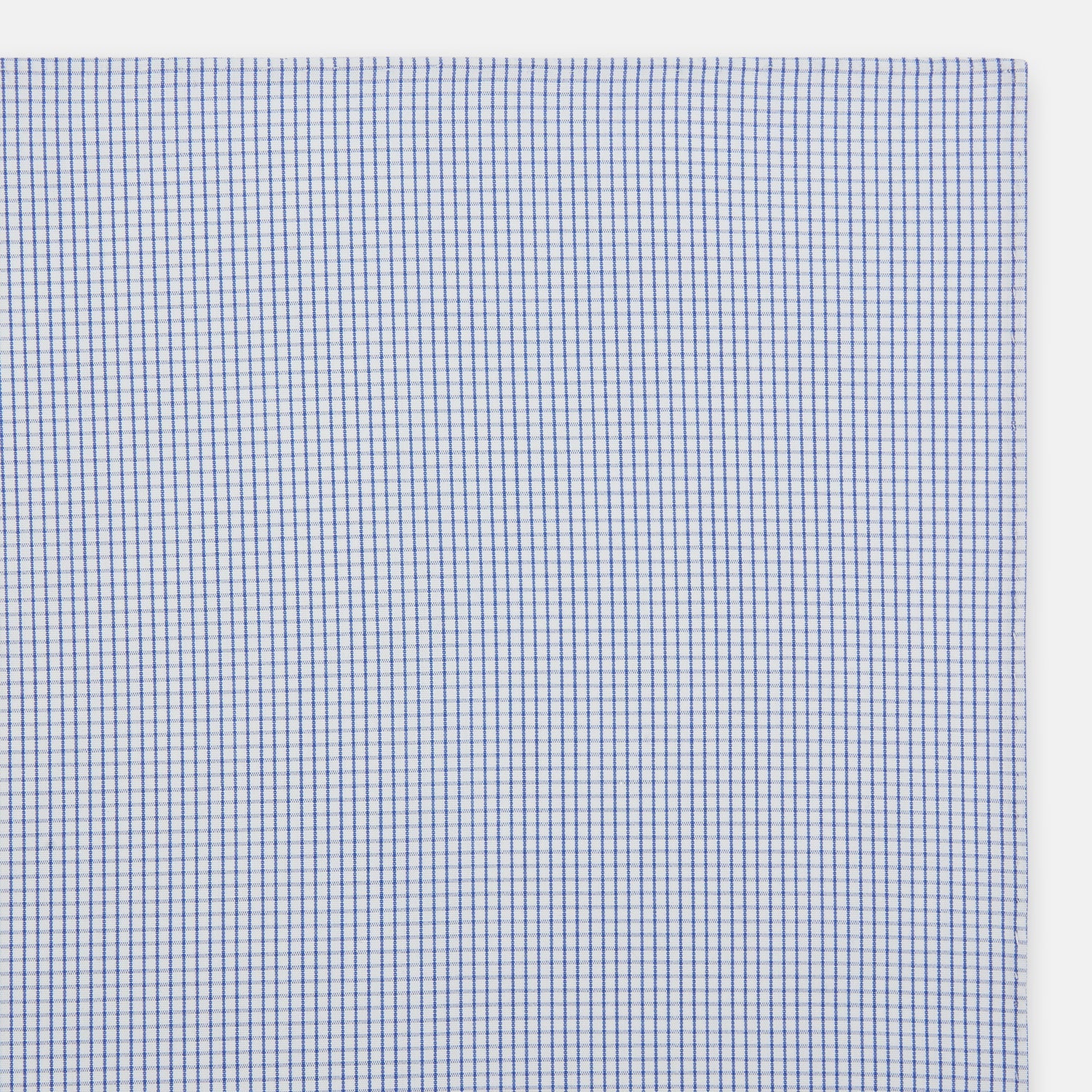 View 2 of product The Turnbull & Asser Hand Rolled Blue Graph Check Handkerchief features a white background with small blue checks—a refined, formal accessory for any occasion.