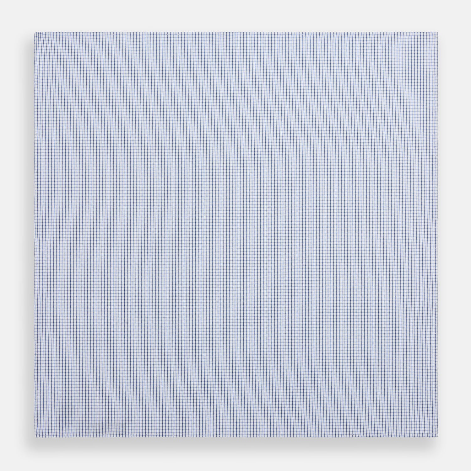 View 3 of product The Turnbull & Asser Hand Rolled Blue Graph Check Handkerchief features a white background with small blue checks—a refined, formal accessory for any occasion.