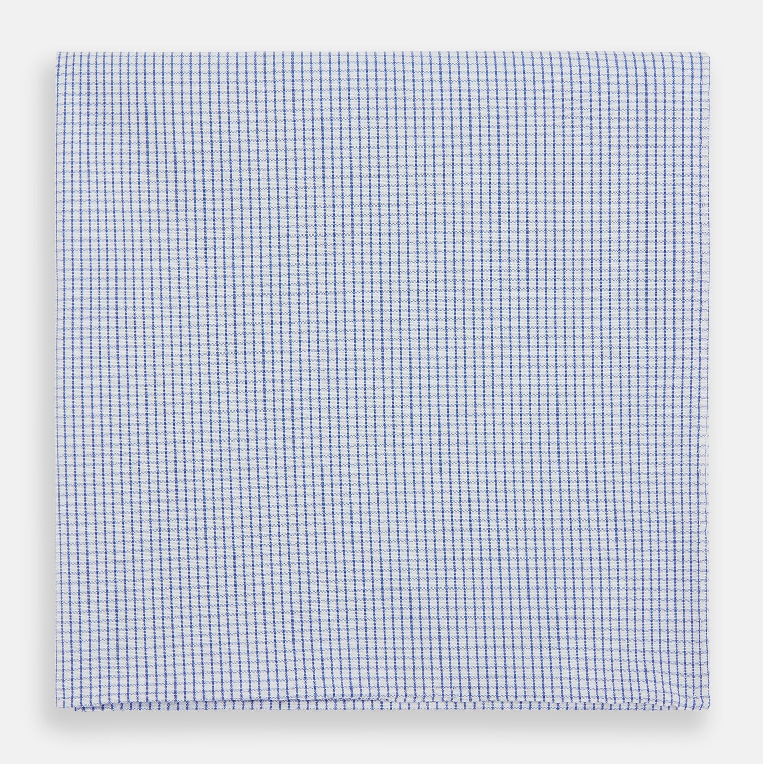 View 1 of product The Turnbull & Asser Hand Rolled Blue Graph Check Handkerchief features a white background with small blue checks—a refined, formal accessory for any occasion.