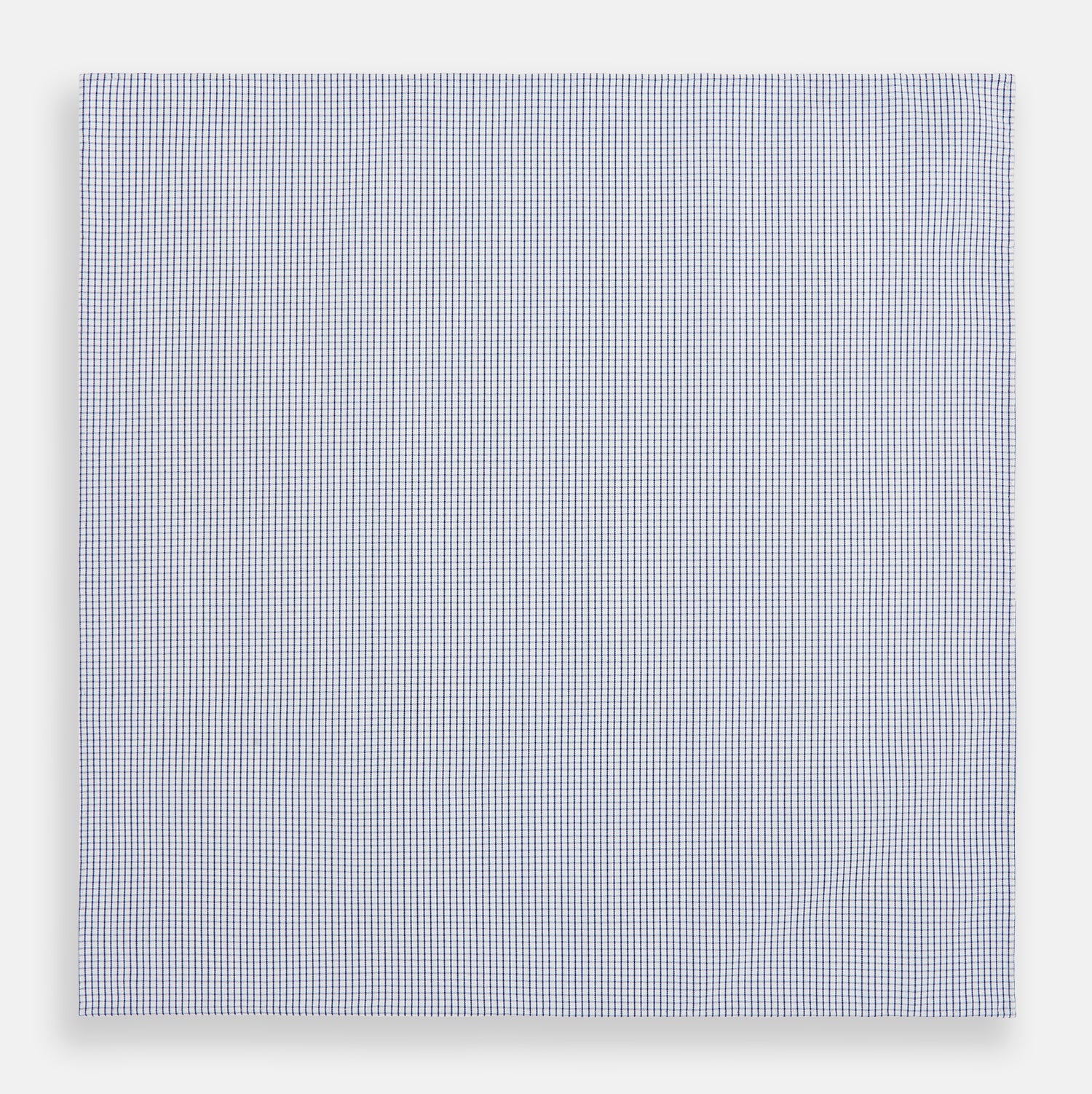 View 3 of product The Turnbull & Asser Hand Rolled Navy Graph Check Handkerchief features evenly spaced navy lines forming a classic grid, offering a clean and timeless look in premium cotton.