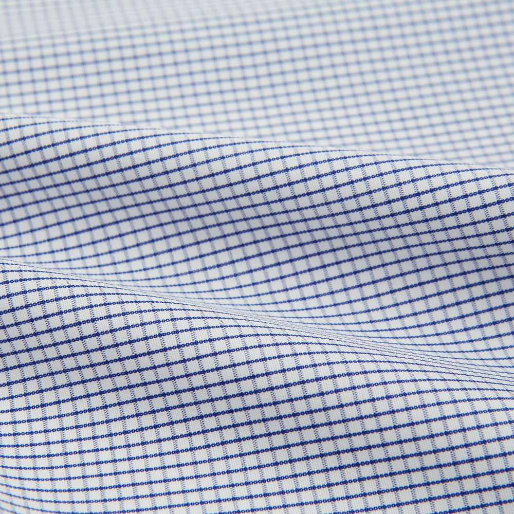 The Turnbull & Asser Hand Rolled Navy Graph Check Handkerchief features evenly spaced navy lines forming a classic grid, offering a clean and timeless look in premium cotton.