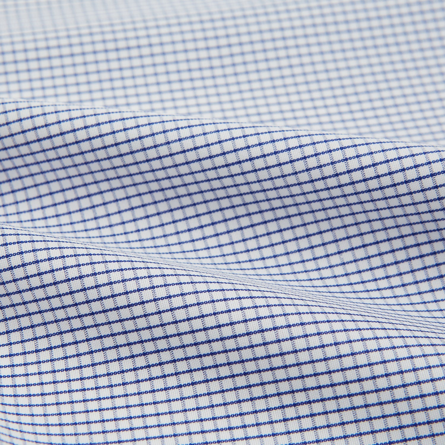 View 4 of product The Turnbull & Asser Hand Rolled Navy Graph Check Handkerchief features evenly spaced navy lines forming a classic grid, offering a clean and timeless look in premium cotton.