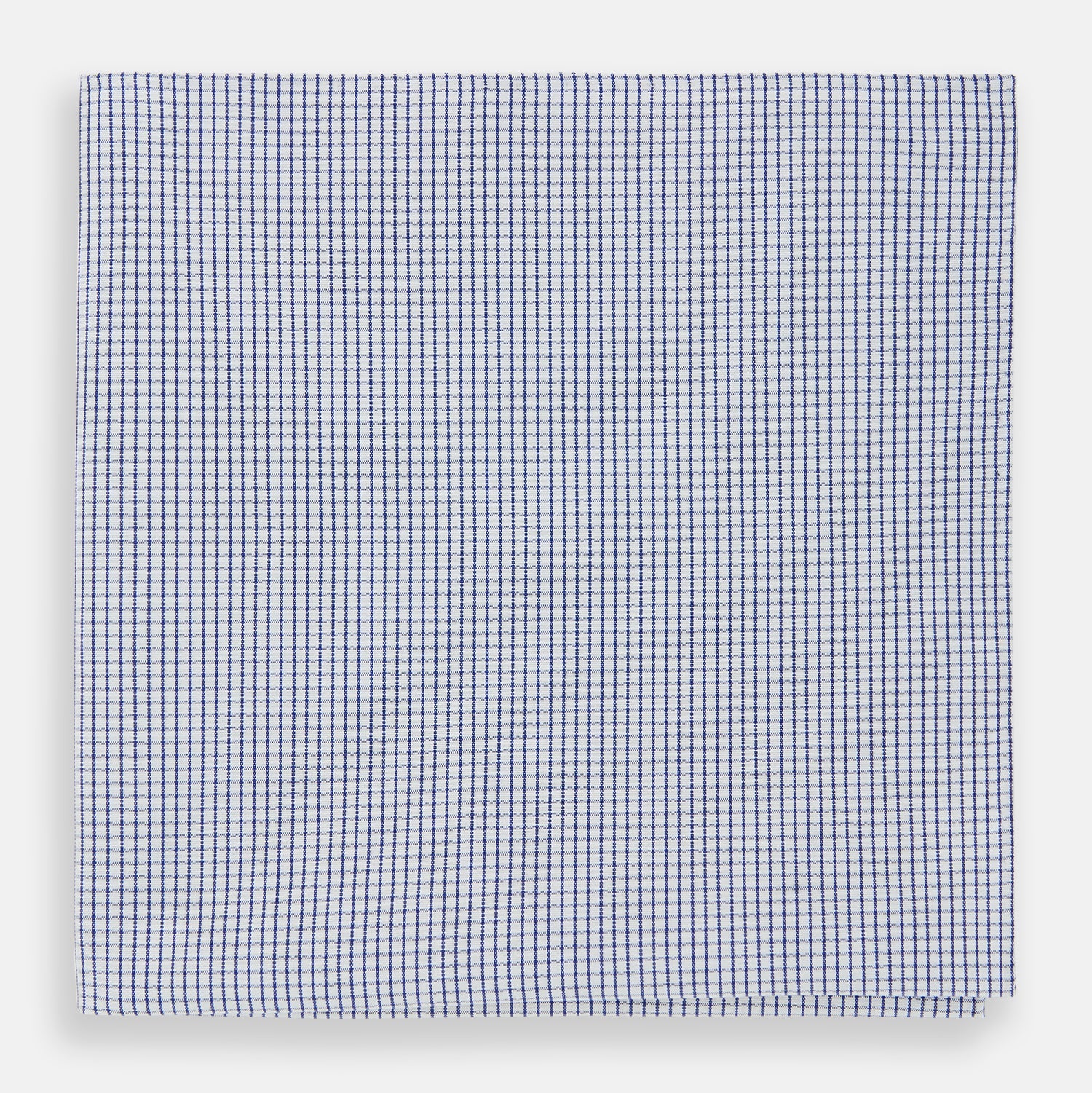 View 1 of product The Turnbull & Asser Hand Rolled Navy Graph Check Handkerchief features evenly spaced navy lines forming a classic grid, offering a clean and timeless look in premium cotton.
