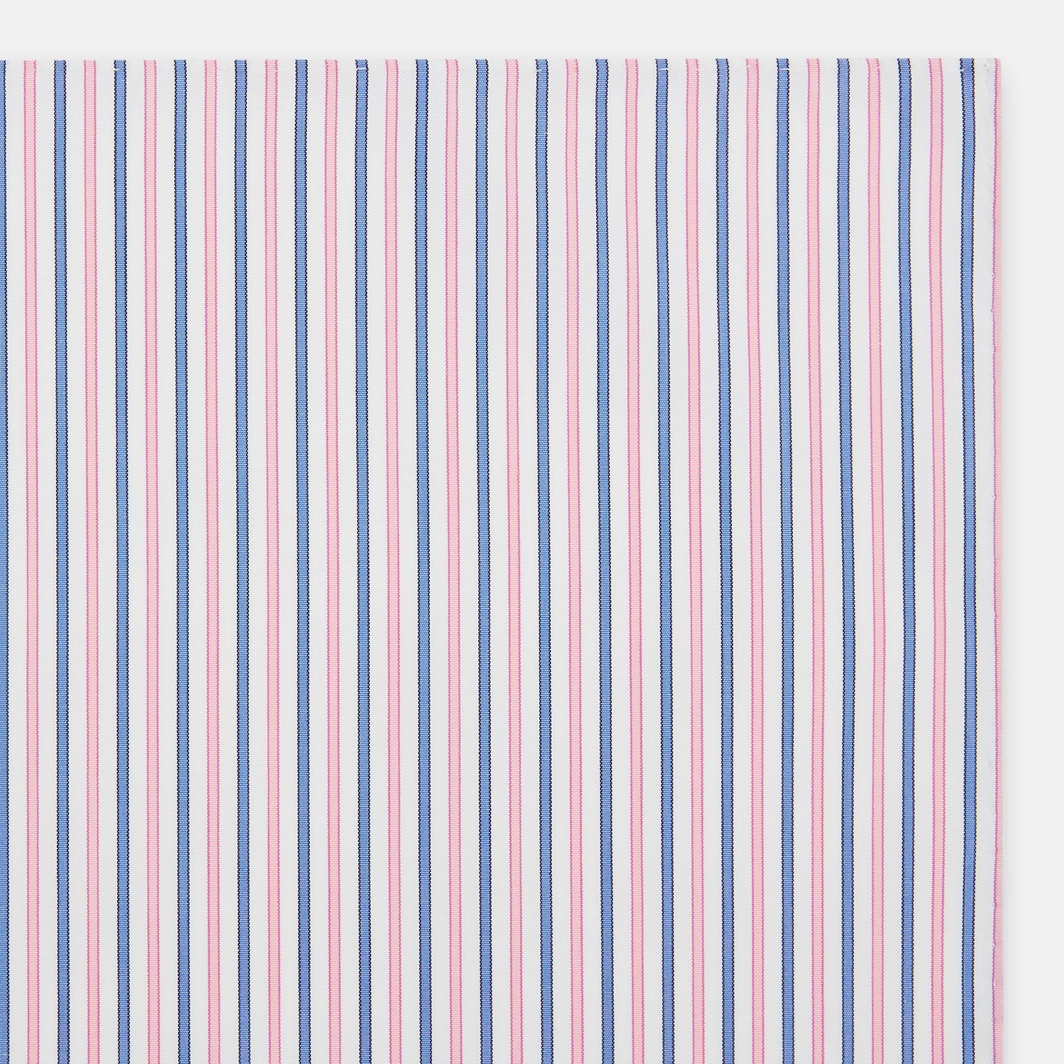 View 2 of product The Turnbull & Asser Hand Rolled Pink and Blue Track Stripe Handkerchief is a cotton square with blue, pink, and purple stripes on white, finished with a hand-rolled pink edge—an elegant addition to formal attire.