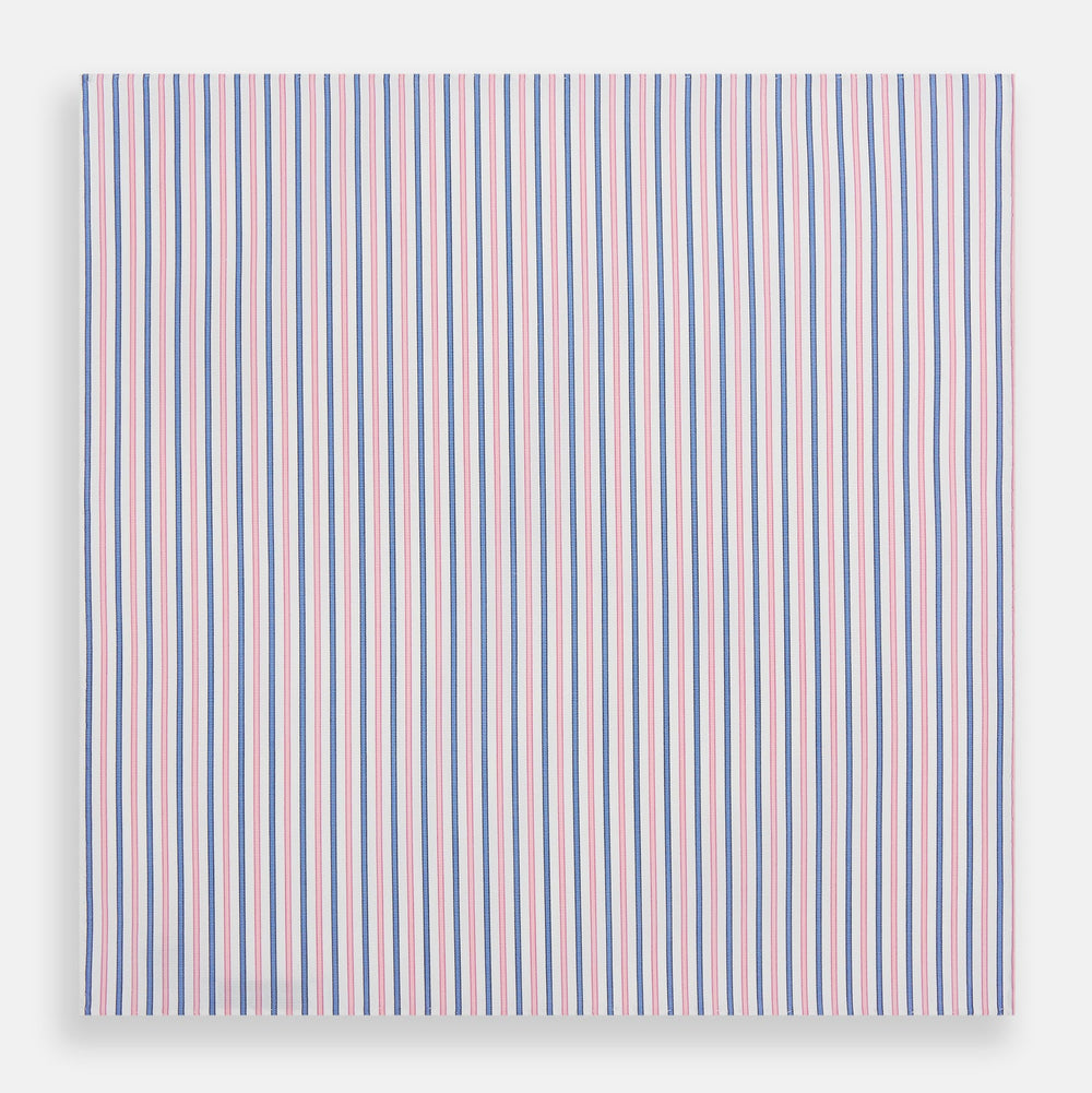 The Turnbull & Asser Hand Rolled Pink and Blue Track Stripe Handkerchief is a cotton square with blue, pink, and purple stripes on white, finished with a hand-rolled pink edge—an elegant addition to formal attire.