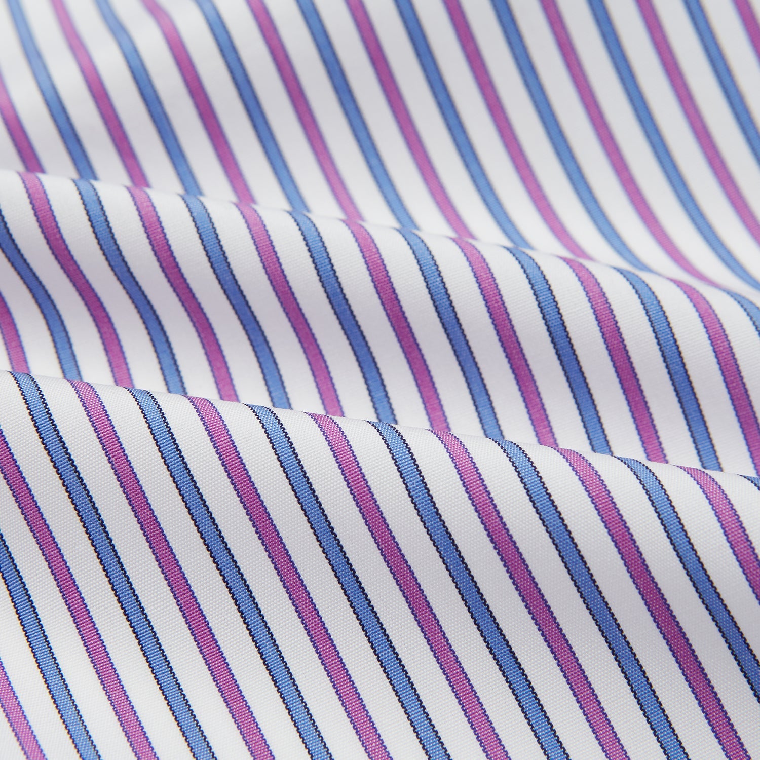 View 4 of product The Turnbull & Asser Hand Rolled Purple and Blue Track Stripe Handkerchief features alternating blue and purple stripes on white cotton—an elegant formal accessory displayed on a plain white background.