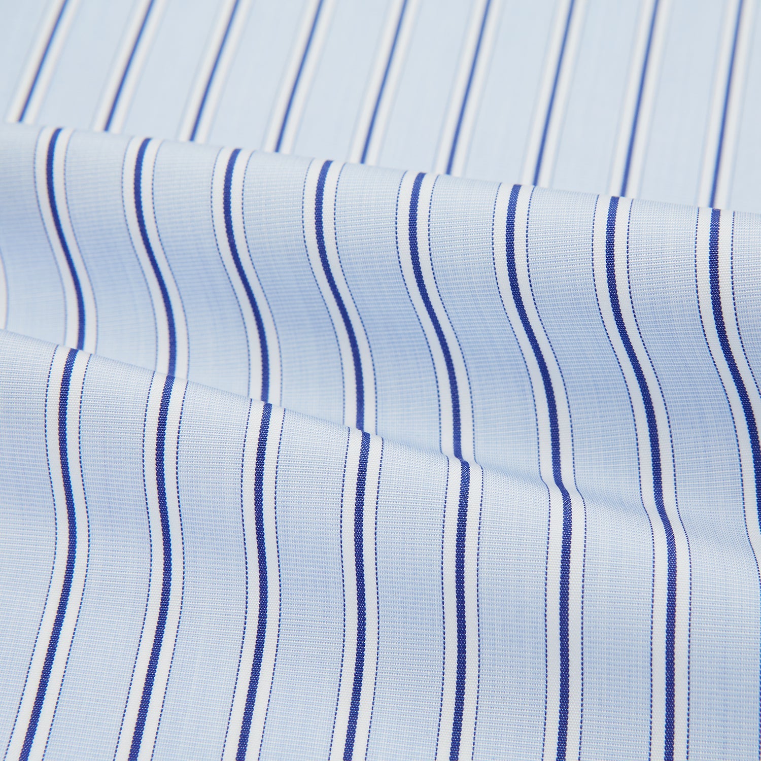 View 4 of product The Turnbull & Asser Hand Rolled Blue Multi Stripe Handkerchief features evenly spaced thin navy stripes—a stylish formal accessory for any occasion.