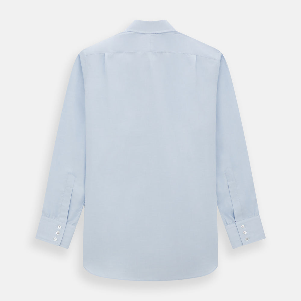 The Turnbull & Asser Blue Cashmerello Mayfair Shirt is a light blue cotton-cashmere blend with long sleeves, pointed collar, white buttons, and buttoned cuffs, shown on a plain white background.