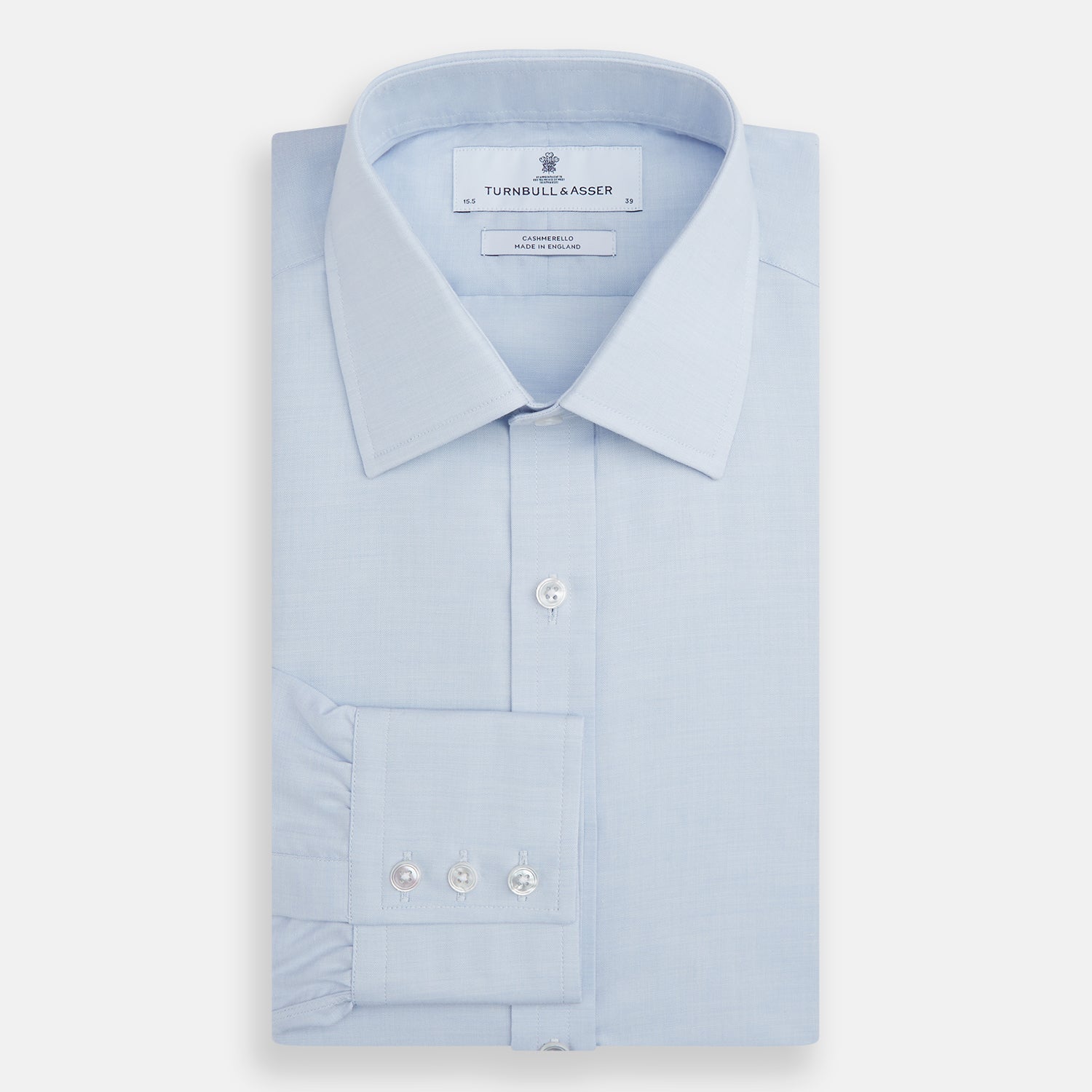 View 4 of product The Turnbull & Asser Blue Cashmerello Mayfair Shirt is a light blue cotton-cashmere blend with long sleeves, pointed collar, white buttons, and buttoned cuffs, shown on a plain white background.