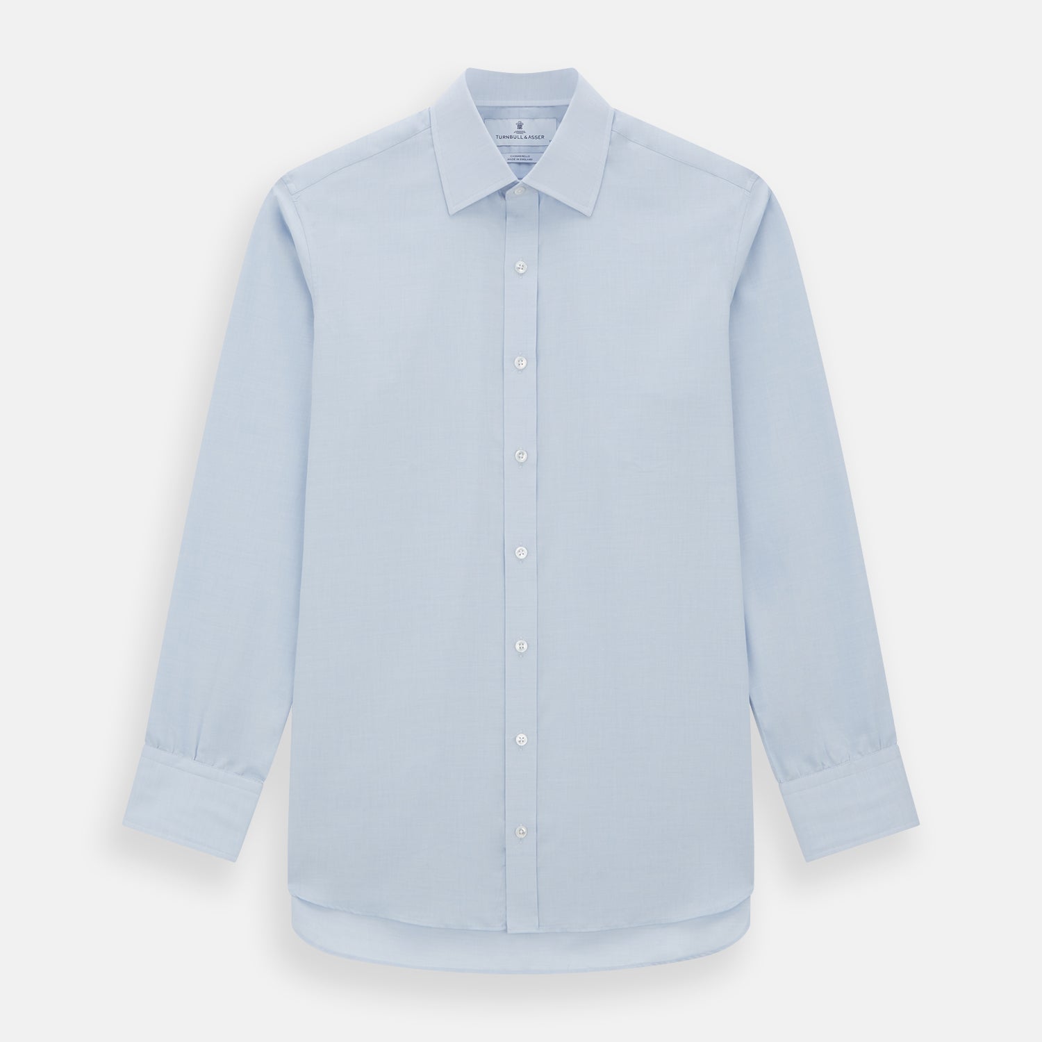 View 1 of product The Turnbull & Asser Blue Cashmerello Mayfair Shirt is a light blue cotton-cashmere blend with long sleeves, pointed collar, white buttons, and buttoned cuffs, shown on a plain white background.