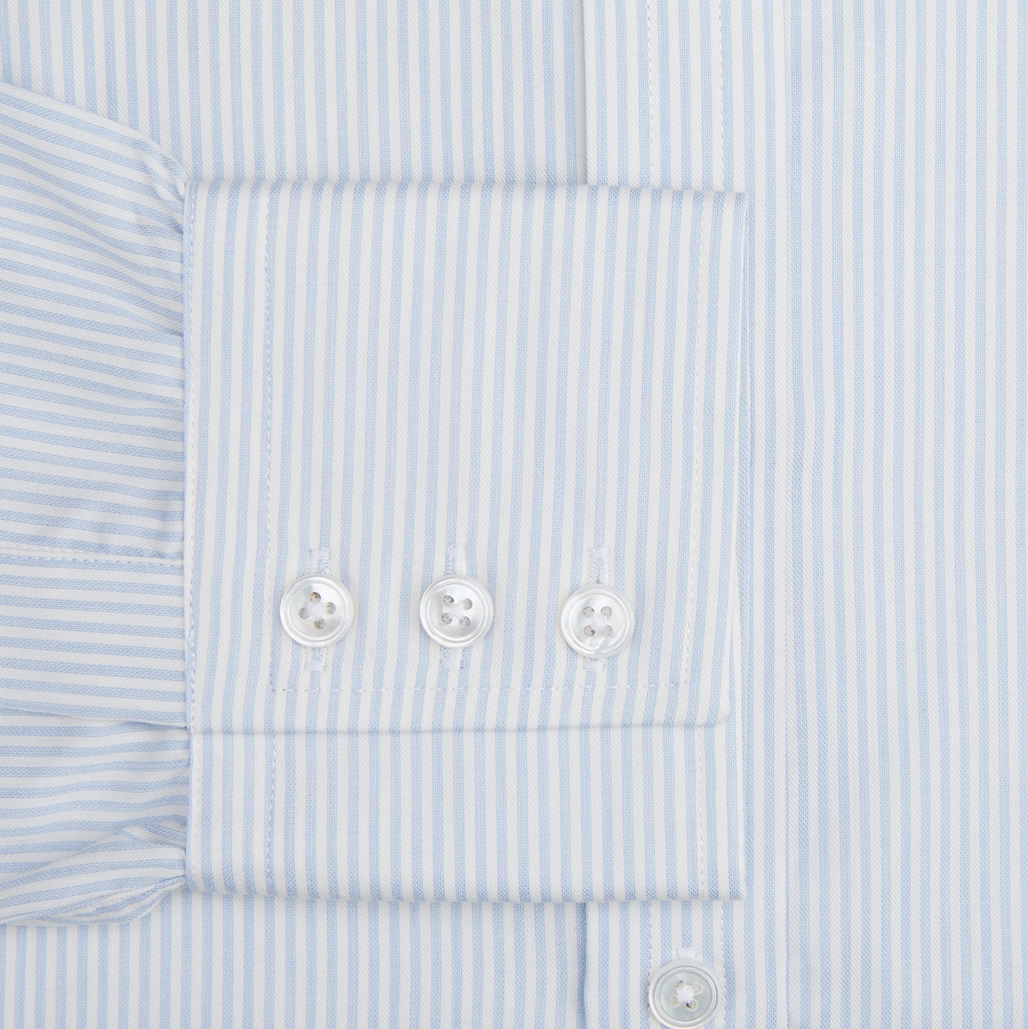 View 3 of product The Turnbull & Asser Blue and White Pencil Stripe Cashmerello Mayfair Shirt features a pointed collar, white buttons, buttoned cuffs, and long sleeves. Crafted from a cotton-cashmere blend, it’s displayed flat on a white background.