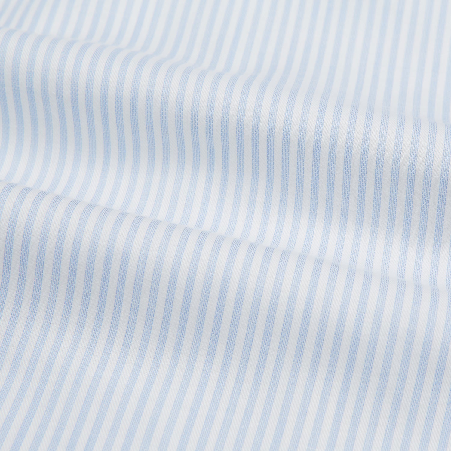 View 5 of product The Turnbull & Asser Blue and White Pencil Stripe Cashmerello Mayfair Shirt features a pointed collar, white buttons, buttoned cuffs, and long sleeves. Crafted from a cotton-cashmere blend, it’s displayed flat on a white background.