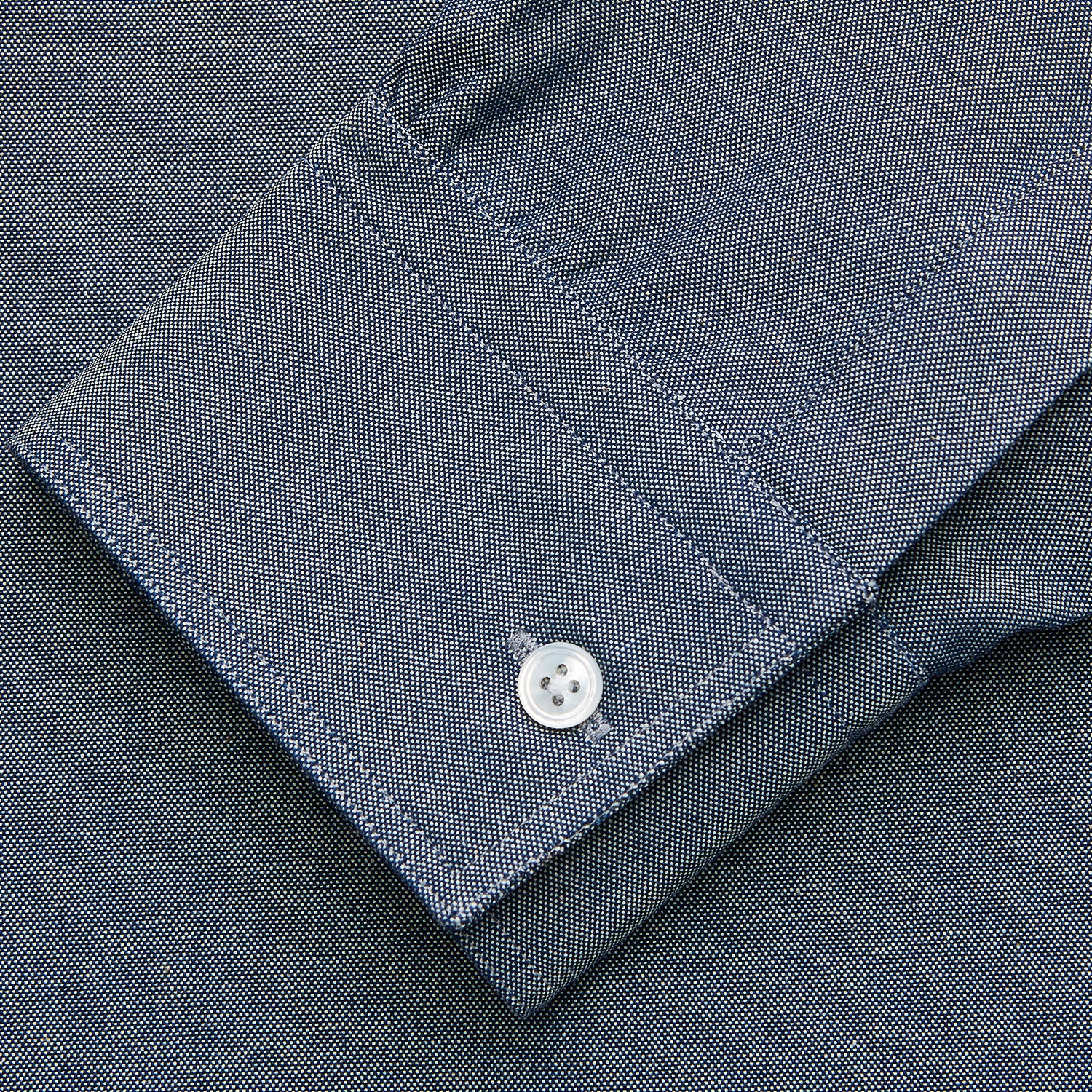 View 3 of product The Turnbull & Asser Blue Chambray Weekend Fit Nevis Cotton Shirt features a Dorset collar, 1-button cuffs, and smart-casual tailoring, shown laid flat on a white background.