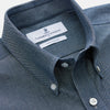 View 2 of product The Turnbull & Asser Blue Chambray Weekend Fit Nevis Cotton Shirt features a Dorset collar, 1-button cuffs, and smart-casual tailoring, shown laid flat on a white background.