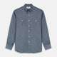 The Turnbull & Asser Blue Chambray Weekend Fit Nevis Cotton Shirt features a Dorset collar, 1-button cuffs, and smart-casual tailoring, shown laid flat on a white background.