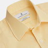 View 2 of product The Turnbull & Asser Yellow Fine Stripe Regular Fit Shirt with T&A Collar features long sleeves, a button-down front, and buttoned cuffs, crafted from fine Italian cotton and shown against a white background.