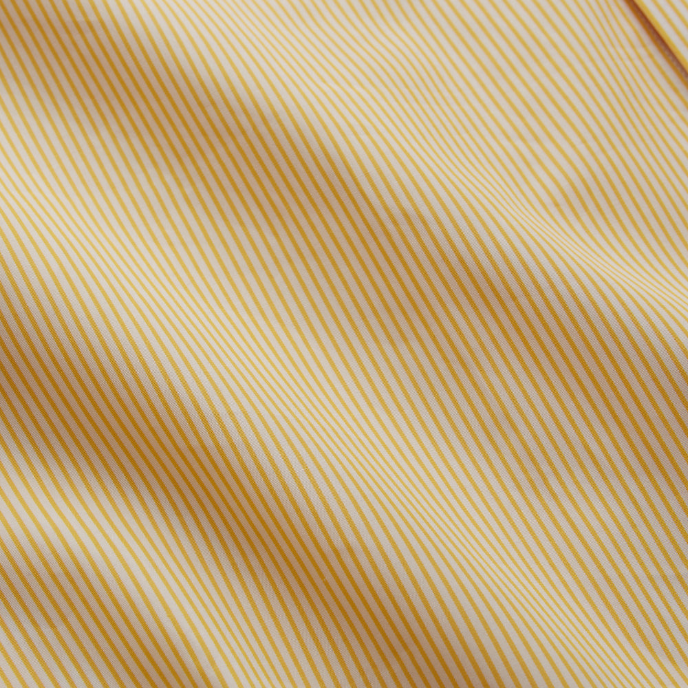 The Turnbull & Asser Yellow Fine Stripe Regular Fit Shirt with T&A Collar features long sleeves, a button-down front, and buttoned cuffs, crafted from fine Italian cotton and shown against a white background.