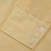 View 3 of product The Turnbull & Asser Yellow Fine Stripe Regular Fit Shirt with T&A Collar features long sleeves, a button-down front, and buttoned cuffs, crafted from fine Italian cotton and shown against a white background.