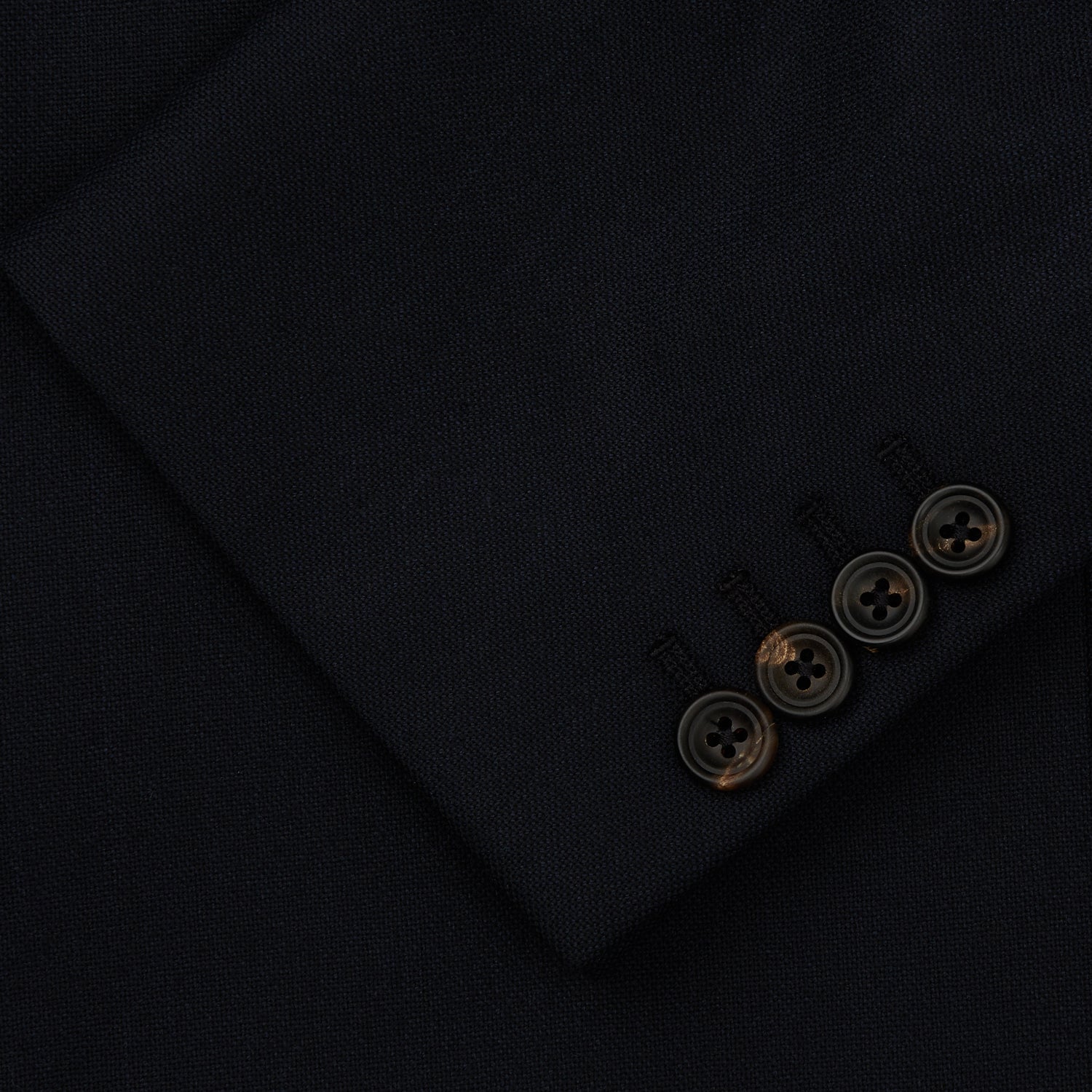 View 3 of product The Midnight Navy Wool Barrington Blazer by Turnbull & Asser features a single-breasted design with notched lapels, three front flap pockets, one chest pocket, and a two-button closure, neatly laid flat against a white background.