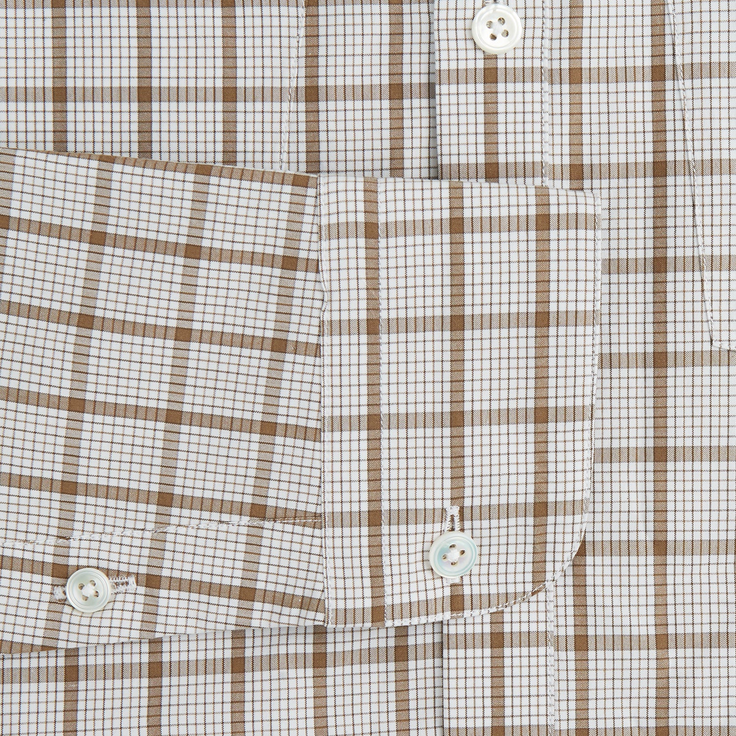 View 3 of product The Turnbull & Asser Brown Graph Overlay Check Piccadilly Shirt is a breathable cotton long-sleeve button-up with two chest pockets, in a beige and brown check pattern—ideal as your holiday fit shirt.
