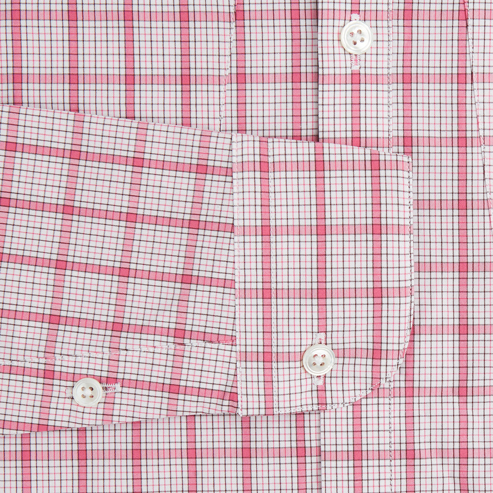 The Pink Graph Overlay Check Piccadilly Shirt by Turnbull & Asser features long sleeves, a button-up front, collar, and chest pockets—a stylish cotton option in a red and white check pattern for the holidays.