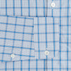 View 3 of product The Turnbull & Asser Blue Graph Overlay Check Piccadilly Shirt is a breathable cotton button-up featuring a collar, two chest pockets, white buttons, and an elegant blue graph check—perfect for the holidays.