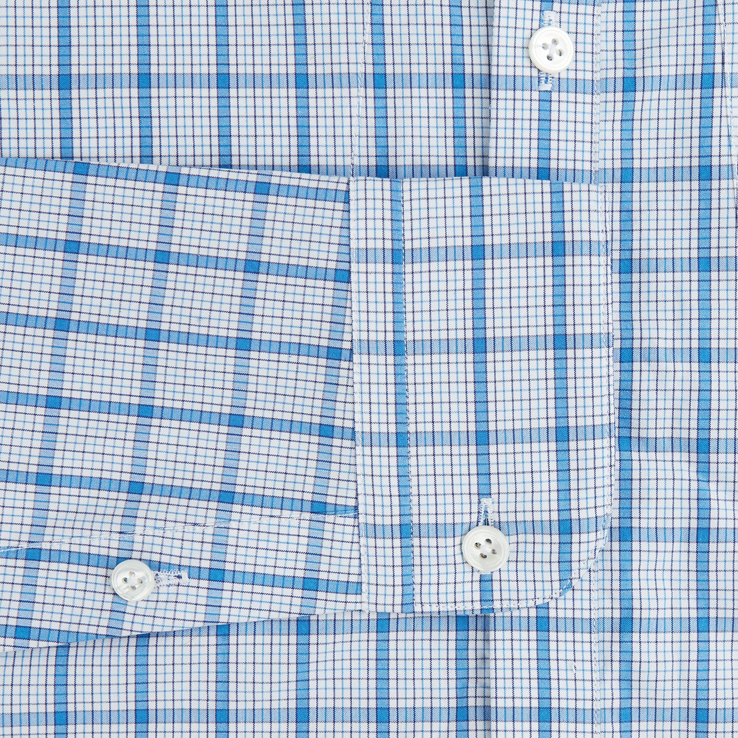 View 3 of product The Turnbull & Asser Blue Graph Overlay Check Piccadilly Shirt is a breathable cotton button-up featuring a collar, two chest pockets, white buttons, and an elegant blue graph check—perfect for the holidays.