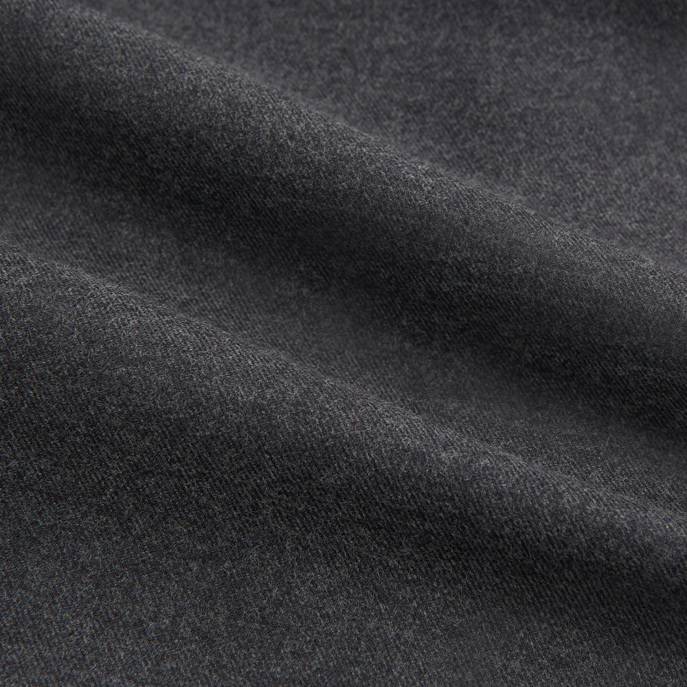 The Charcoal Chelsea Shirt by Turnbull & Asser is a long-sleeve, collared shirt in charcoal gray with a single chest pocket, offering smart-casual style, shown on a plain white background.