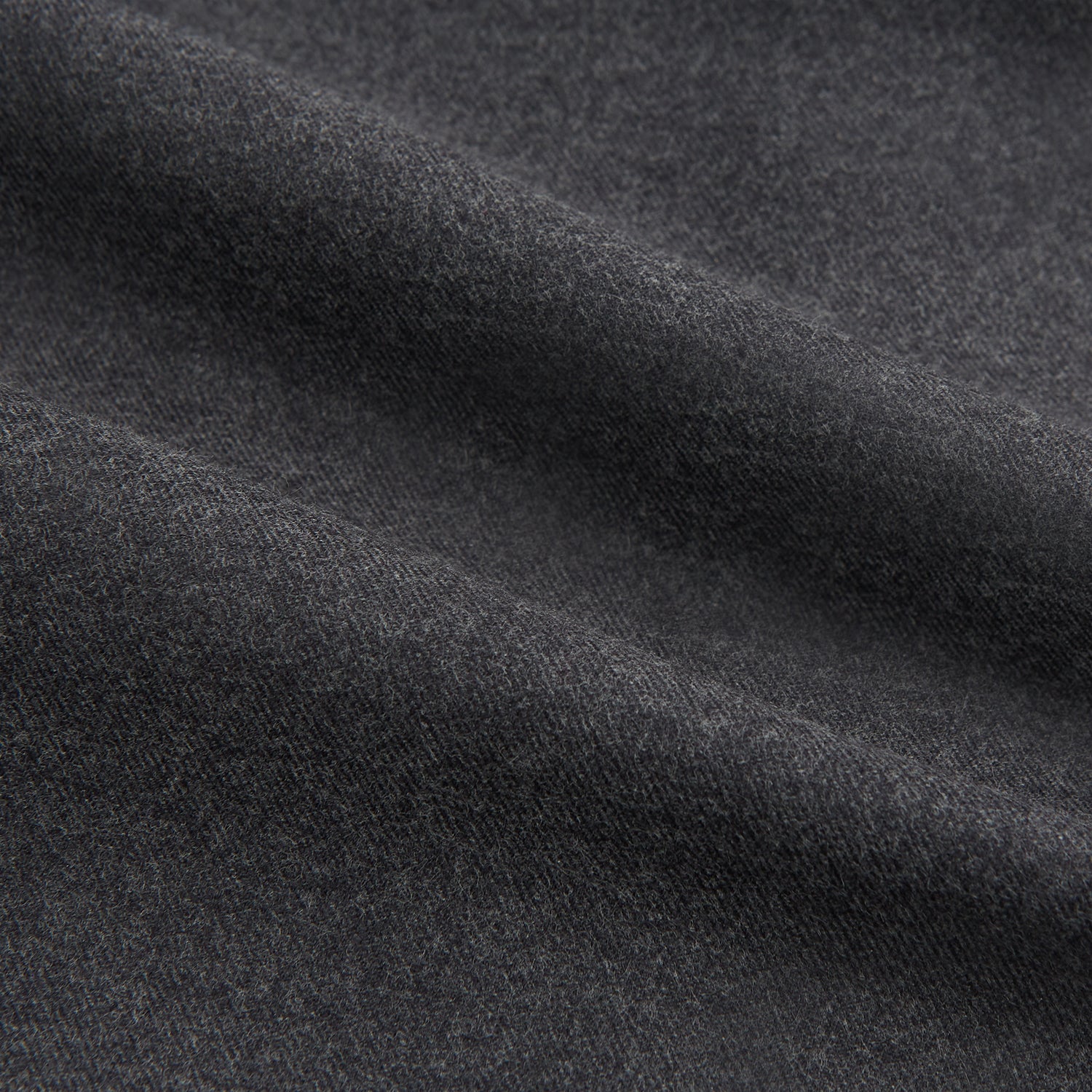 View 6 of product The Charcoal Chelsea Shirt by Turnbull & Asser is a long-sleeve, collared shirt in charcoal gray with a single chest pocket, offering smart-casual style, shown on a plain white background.