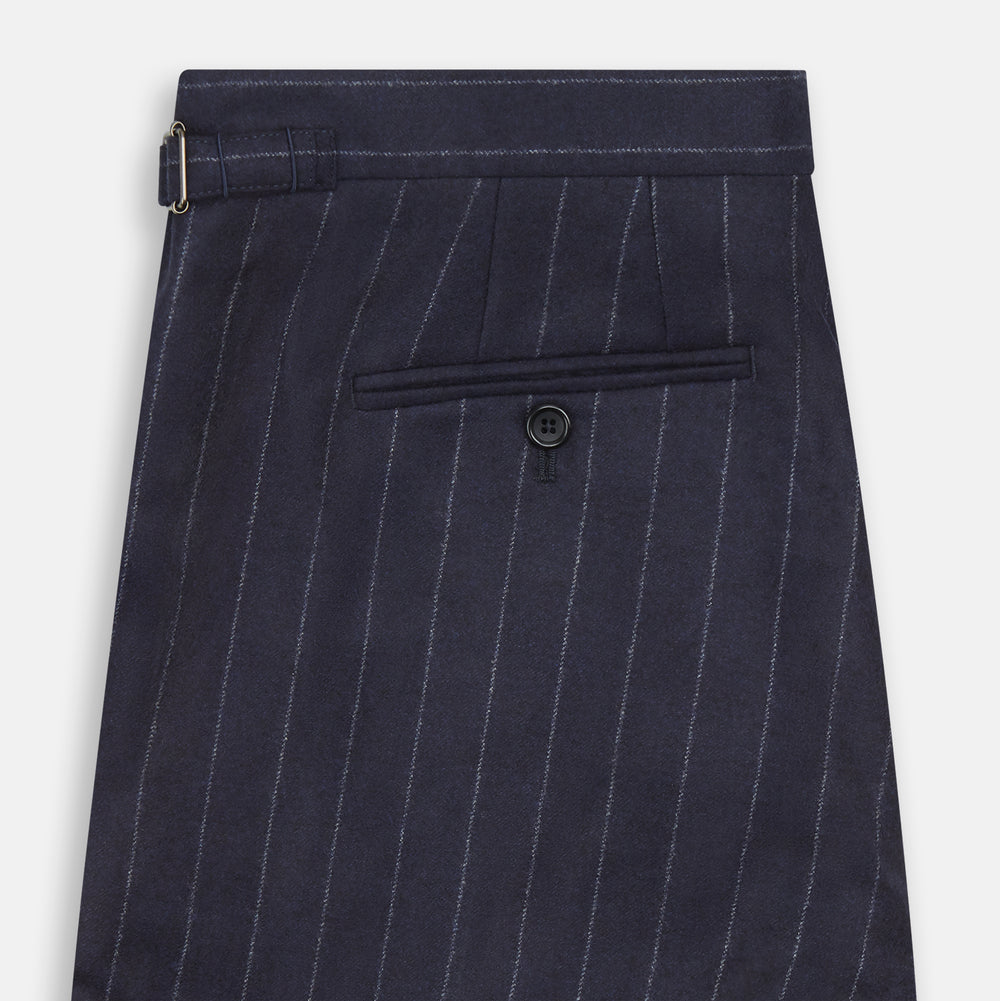 The Navy Pinstripe Henry Trousers by Turnbull & Asser feature vertical white stripes, a tailored fit, button closure, and belt loops. Crafted from a wool cashmere blend, they are shown against a plain white background.