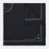 View 4 of product Introducing the Casino Royale Midnight Blue Crest Pocket Square in Silk from Turnbull & Asser UK—a midnight blue silk pocket square bordered in white, featuring playing card suit symbols at each corner and a central motif depicting the 10, J, Q, and K of spades beneath a crown and laurel. Perfect as a sophisticated Casino Royale or Bond tuxedo accessory, with “Turnbull & Asser” elegantly displayed in the lower right.