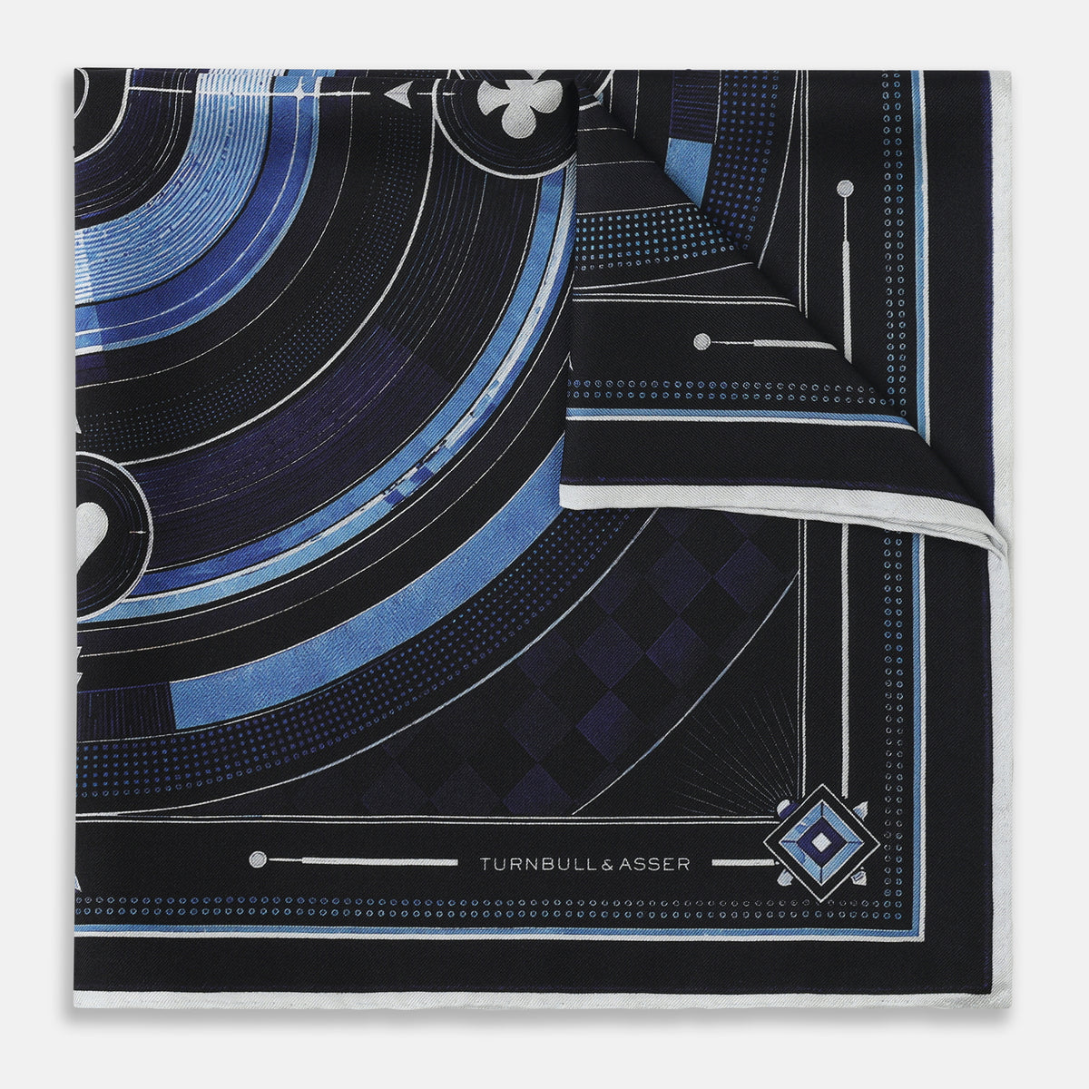 View 4 of product Presenting the Casino Royale Midnight Blue Target Pocket Square in Silk from Turnbull & Asser UK—a luxurious silk square scarf adorned with concentric circles in rich midnight blue and black, accented by playing card suit symbols (spade, diamond, club, heart) at each cardinal point and striking geometric patterns in the corners. This elegant accessory is perfect for adding a touch of sophisticated intrigue to your ensemble.