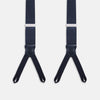 View 2 of product The Turnbull & Asser UK Casino Royale Midnight Blue Braces in Silk, featuring leather and elastic looped ends inspired by the iconic Casino Royale style, are displayed vertically against a white background—a sophisticated accessory for formal eveningwear.