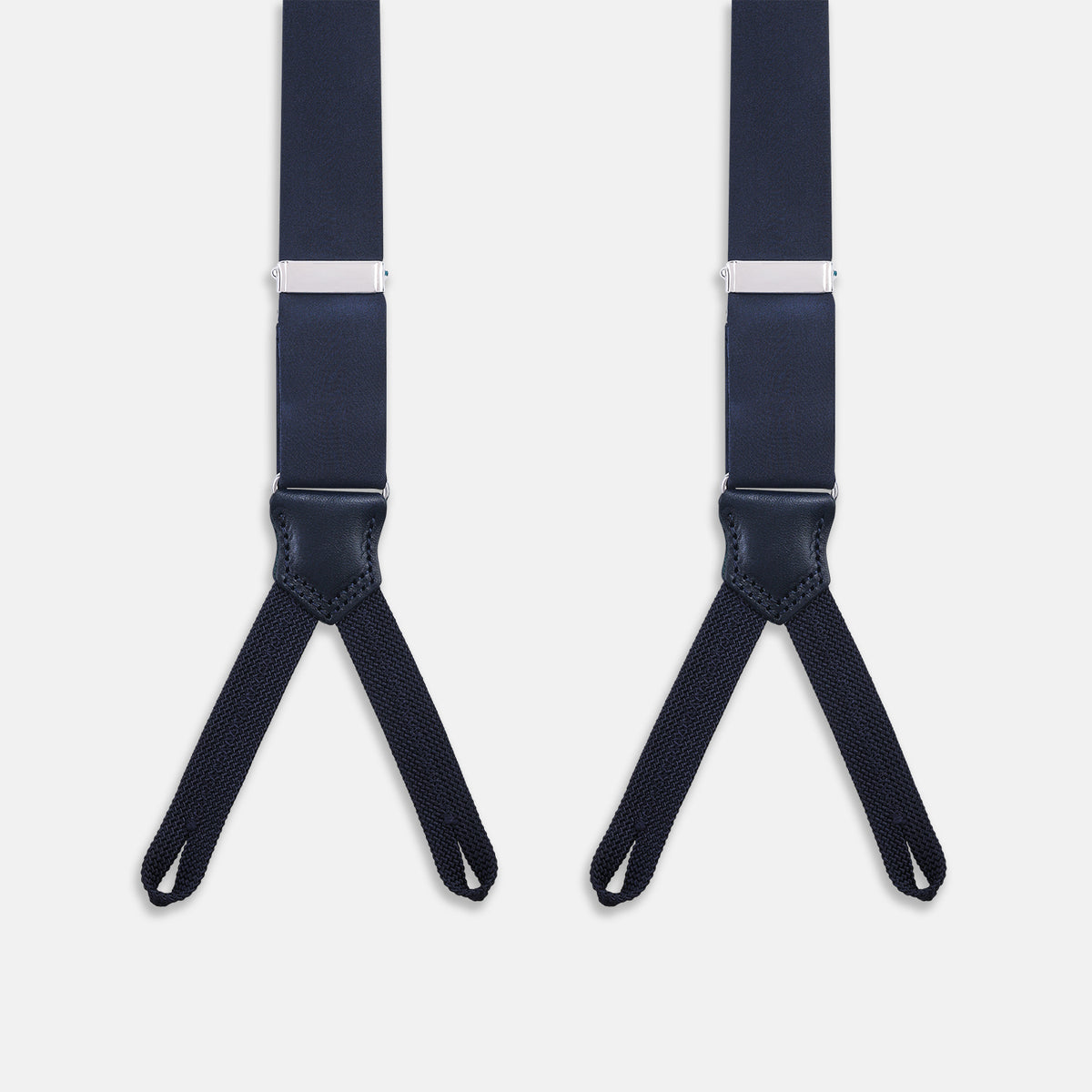 View 2 of product The Turnbull & Asser UK Casino Royale Midnight Blue Braces in Silk, featuring leather and elastic looped ends inspired by the iconic Casino Royale style, are displayed vertically against a white background—a sophisticated accessory for formal eveningwear.