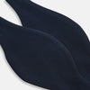 View 3 of product A classic Casino Royale Midnight Blue Bow Tie in silk by Turnbull & Asser UK, crafted from luxurious silk with a smooth texture, is neatly tied and displayed against a plain white background.