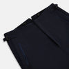 View 2 of product The Casino Royale Midnight Blue Tuxedo Trousers in Wool by Turnbull & Asser UK are shown from the back, expertly crafted from virgin wool in a signature tuxedo style, featuring two buttoned back pockets and adjustable side tabs at the waistband.
