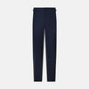 View 1 of product The Casino Royale Midnight Blue Tuxedo Trousers in Wool by Turnbull & Asser UK are shown from the back, expertly crafted from virgin wool in a signature tuxedo style, featuring two buttoned back pockets and adjustable side tabs at the waistband.