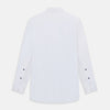 View 3 of product The Casino Royale White Dress Shirt in Cotton by Turnbull & Asser UK is a long-sleeve white dress shirt, crafted from crisp white cotton poplin with a pleated bib front, black buttons, and a classic collar, shown laid flat on a white background.